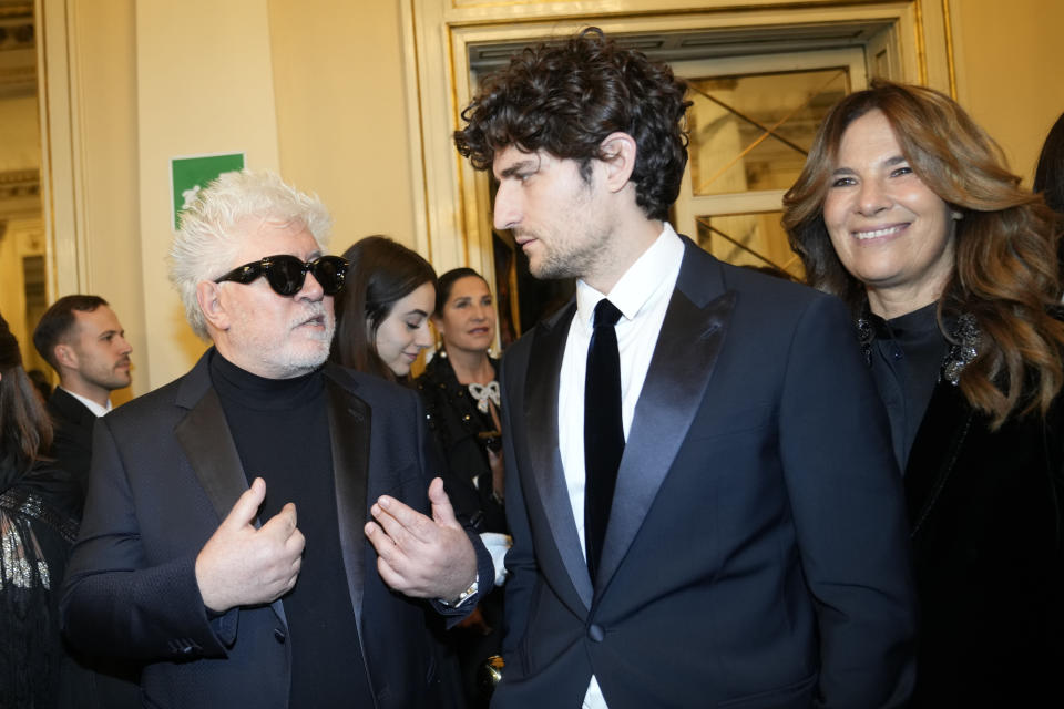 Spanish Director Pedro Almodovar, left, and French actor Louis Garrel arrive to attend La Scala opera house's gala season opener, Giuseppe Verdi's opera 'Don Carlo' at the Milan La Scala theater, Italy, Thursday Dec. 7, 2023. The season-opener Thursday, held each year on the Milan feast day St. Ambrose, is considered one of the highlights of the European cultural calendar. (AP Photo/Luca Bruno)