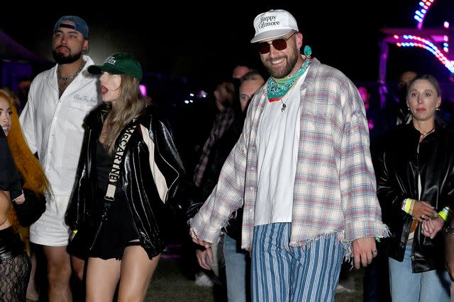 <p>Gilbert Flores/WWD via Getty</p> Taylor Swift and Travis Kelce at Neon Carnival during Coachella Music Festival