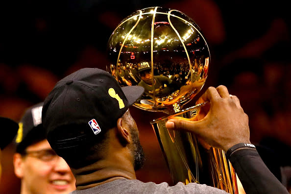 OAKLAND, CA – JUNE 19: LeBron James #23 of the Cleveland Cavaliers holds the Larry O’Brien Championship Trophy after defeating the Golden State Warriors 93-89 in Game 7 of the 2016 NBA Finals at ORACLE Arena on June 19, 2016 in Oakland, California. (Photo by Ezra Shaw/Getty Images)