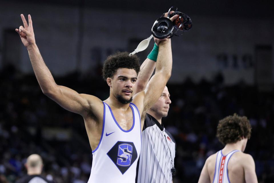 Stillwater's JJ McComas defeats Bixby's Isaiah Jones in the Class 6A 132-pound match on Feb. 24 at State Fair Arena.