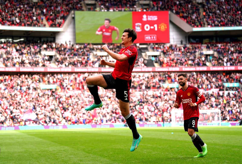 Manchester United's Harry Maguire celebrates scoring his side's second goal during the English FA Cup semi-final soccer match between Coventry City and Manchester United at Wembley Stadium. Bradley Collyer/PA Wire/dpa