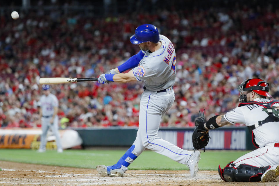 New York Mets' Jeff McNeil hits a solo home run off Cincinnati Reds starting pitcher Luis Castillo in the sixth inning of a baseball game Friday, Sept. 20, 2019, in Cincinnati. (AP Photo/John Minchillo)