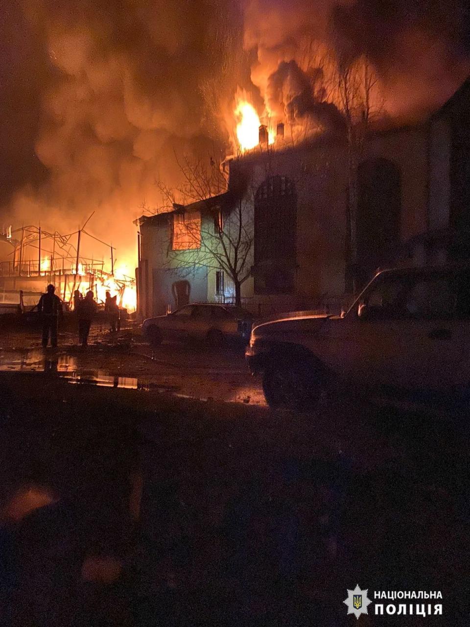 Smoke and fire rise from a building in the aftermath of a Russian drone strike at a location given as Kharkiv region (via REUTERS)