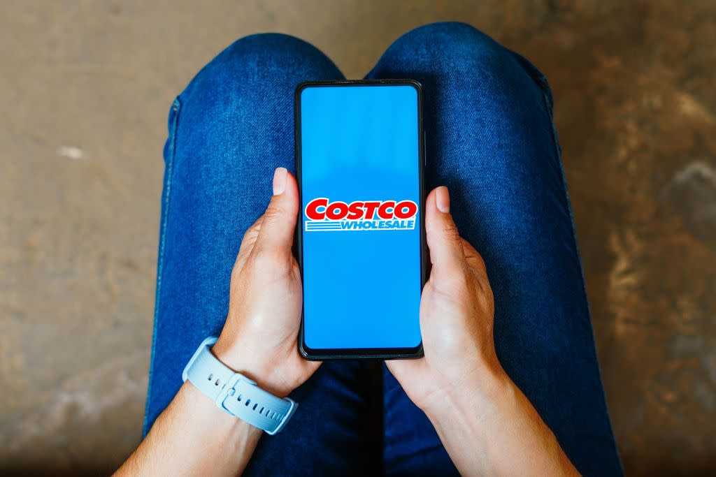 in this photo illustration, the costco wholesale logo is