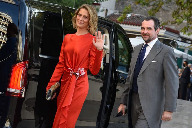 <p>Nicolas Koutsokostas/NurPhoto via Getty</p> Princess Tatiana and Prince Nikolaos arrive at the Metropolitan Cathedral of Athens for the wedding of Prince Philippos to Nina Flohr in October 2021.