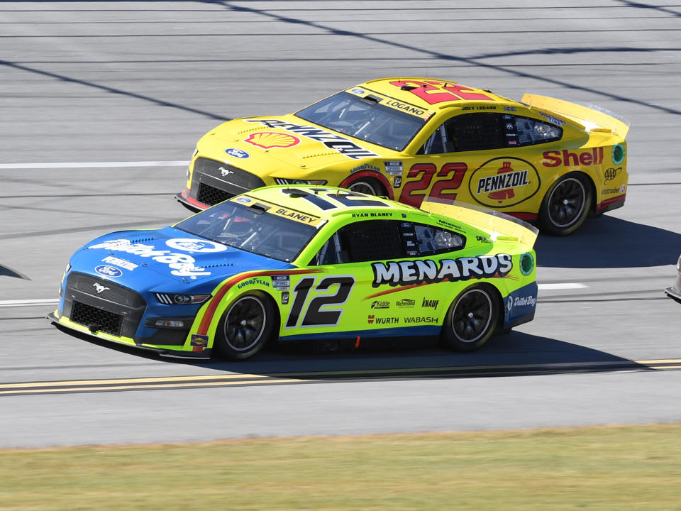 TALLADEGA, AL - OCTOBER 02: Ryan Blaney (#12 Team Penske Menards&#92;Dutch Boy Ford) and teammate Joey Logano (#22 Team Penske Shell Pennzoil Ford) race down the front stretch during the running of the NASCAR Cup Series YellaWood 500 on October 02, 2022, at Talladega Superspeedway in Talladega, AL. (Photo by Jeffrey Vest/Icon Sportswire via Getty Images)