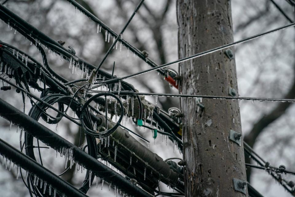Ice covers metro Detroit, including power lines, causing widespread power outages on Thursday, Feb. 23, 2023.