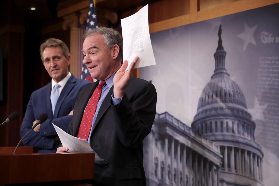 Sen. Jeff Flake, R-Ariz, left, and Sen. Tim Kaine, D-Va., talk about their introduction of a new Authorization for the Use of Military Force (AUMF) against the Islamic State of Iraq and Syria (ISIS), al-Qaida and the Taliban during a news conference at the Capitol on May 25, 2017. (Photo by Chip Somodevilla/Getty Images)