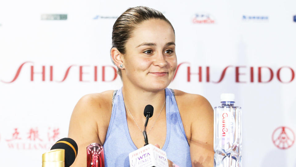 Ash Barty (pictured) smiles during a press conference.