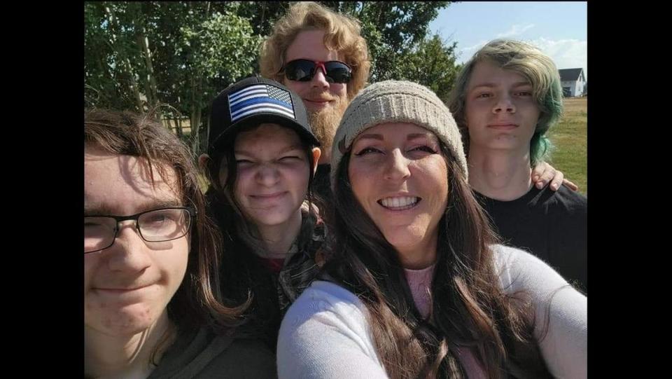 TikTok creator Heather DiRocco with her husband and three children.