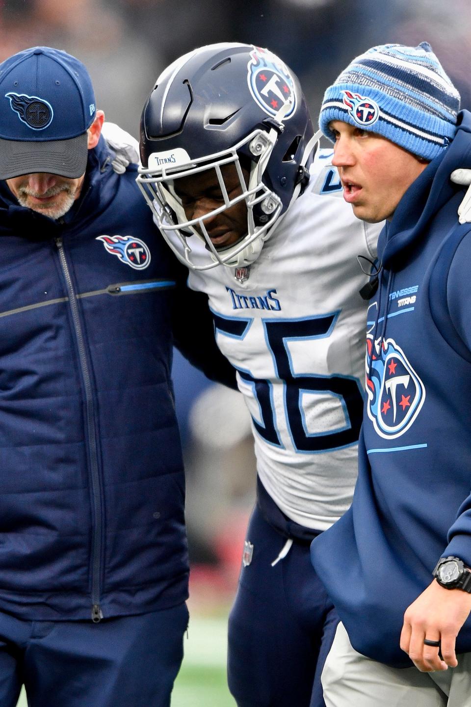 Tennessee Titans linebacker Monty Rice (56) is helped off the field during the second quarter at Gillette Stadium Sunday, Nov. 28, 2021 in Foxborough, Mass. 