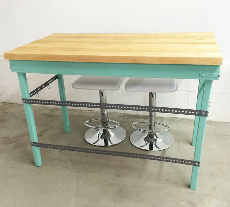 Table with butcher block top made into kitchen island