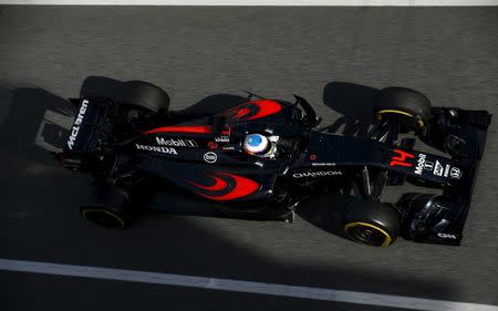 McLaren Formula One driver Fernando Alonso drives to the pitlane during a testing session at Barcelona-Catalunya racetrack in Montmelo, near Barcelona, Spain, March 3, 2016. REUTERS/Albert Gea