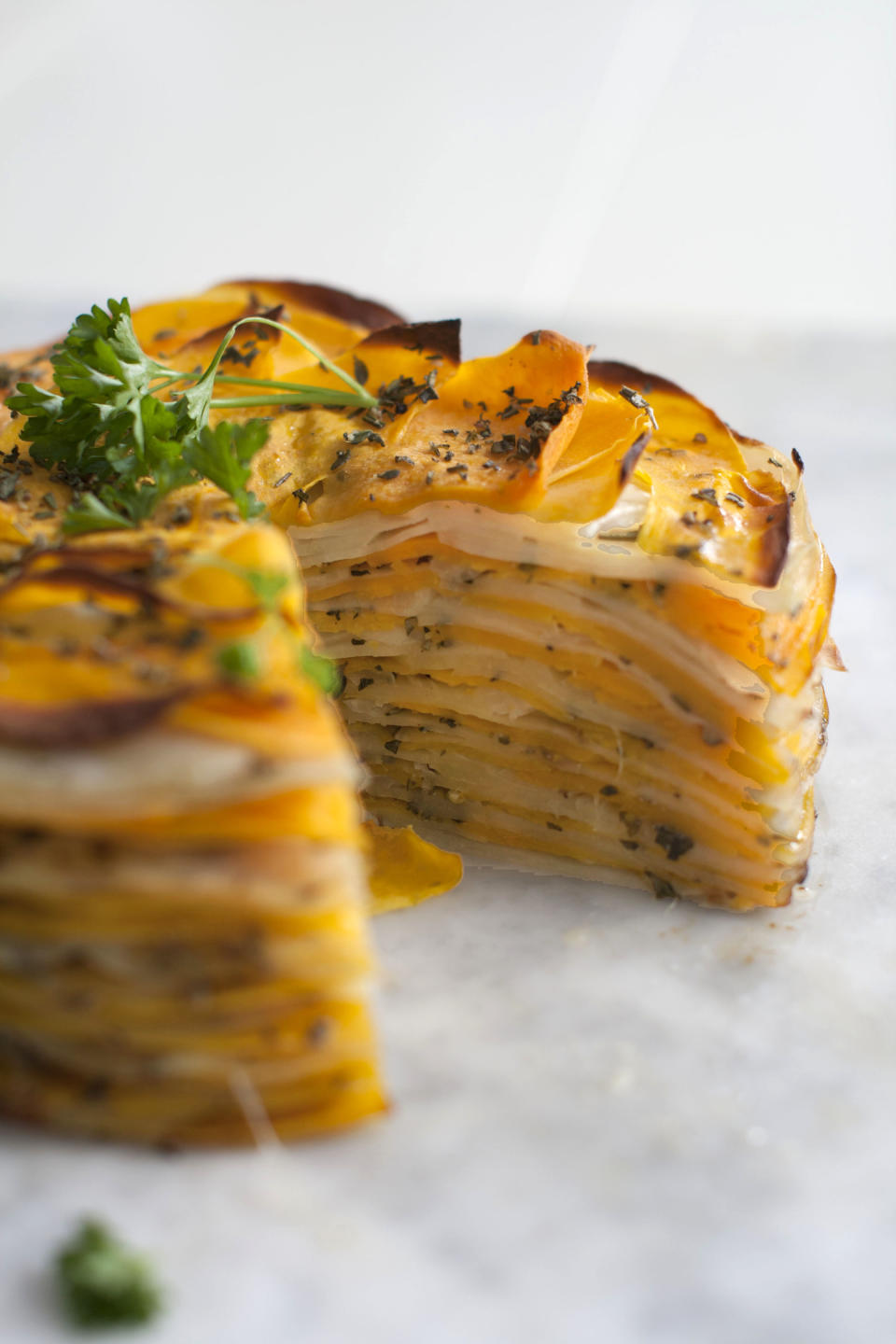 This March 31, 2014 photo shows roasted butternut and herb tart in Concord, N.H. (AP Photo/Matthew Mead)