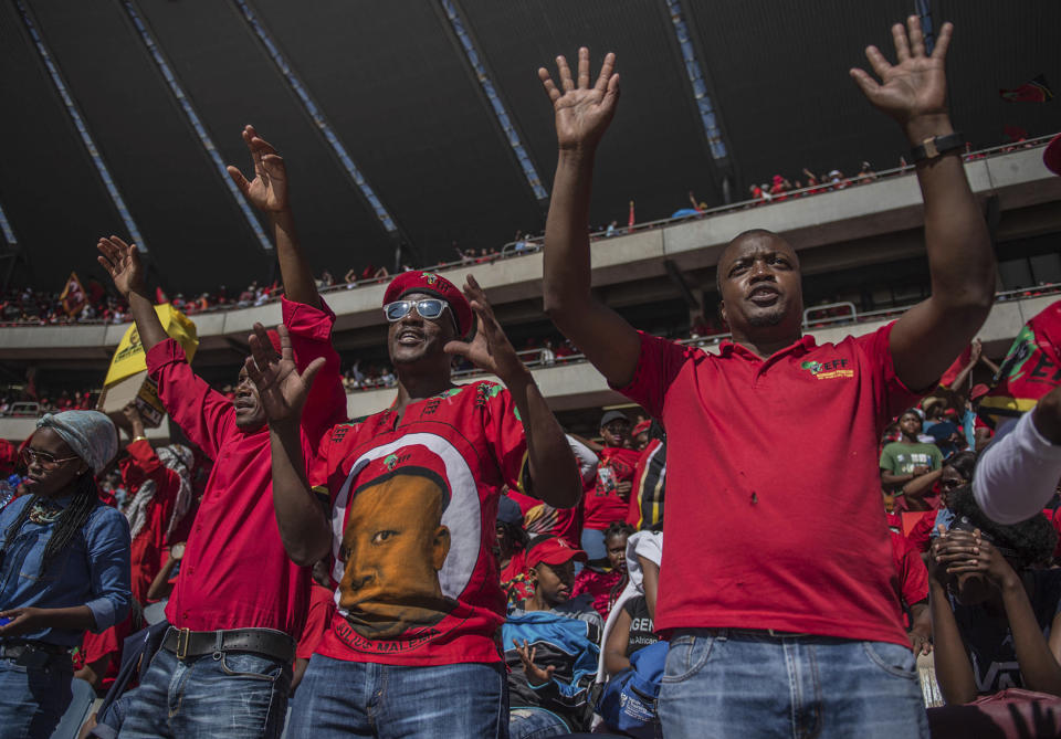 Supporters of the Economic Freedom Fighters (EFF) party attend their election rally at the Orlando Stadium in Soweto, South Africa, Sunday, May 5, 2019, ahead of South Africa's election on May 8. (AP Photo/Mujahid Safodien)