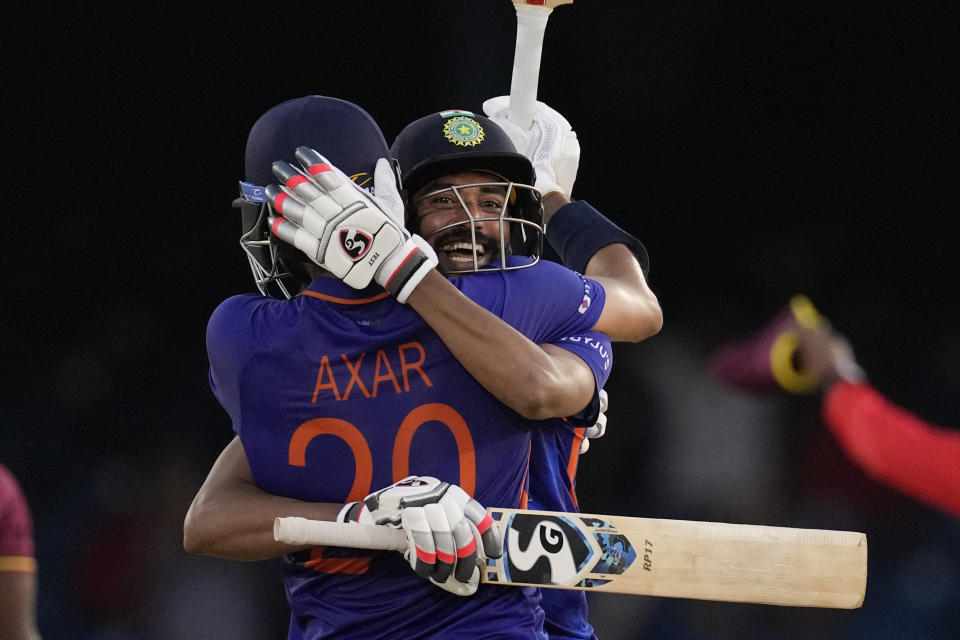 India's Axar Patel is embraced by teammate Mohammed Siraj after hitting a six to win the second ODI cricket match against West Indies at Queen's Park Oval in Port of Spain, Trinidad and Tobago, Sunday, July 24, 2022. (AP Photo/Ricardo Mazalan)