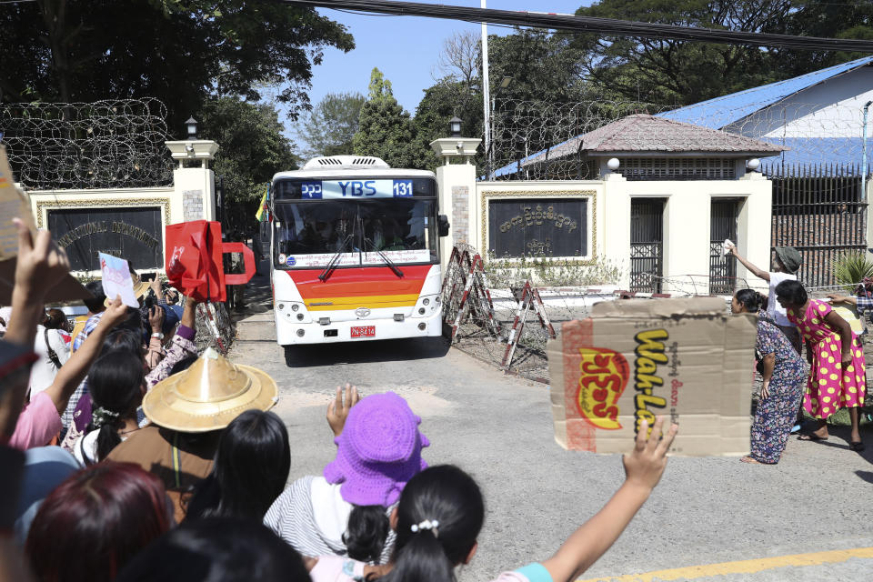 A bus carrying released prisoners is welcomed by family members and colleagues as it leaves Insein Prison in Yangon, Myanmar, Thursday, Jan. 4, 2024. Myanmar’s military government on Thursday pardoned nearly 10,000 prisoners to mark the 76th anniversary of gaining independence from Britain, but it wasn’t immediately clear if any of those released included the thousands of political detainees jailed for opposing army rule. (AP Photo/Thein Zaw)