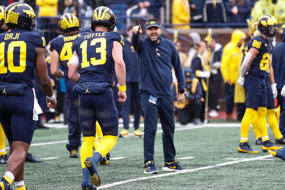 Michigan quarterbacks coach Kirk Campbell watches warmups before the Indiana game at Michigan Stadium in Ann Arbor on Saturday, Oct. 14, 2023.