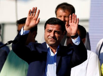 FILE PHOTO: Selahattin Demirtas, co-leader of the pro-Kurdish Peoples' Democratic Party (HDP), greets the crowd during a peace rally to protest against Turkish military operations in northern Syria, in Istanbul, Turkey September 4, 2016. REUTERS/Osman Orsal/File Photo