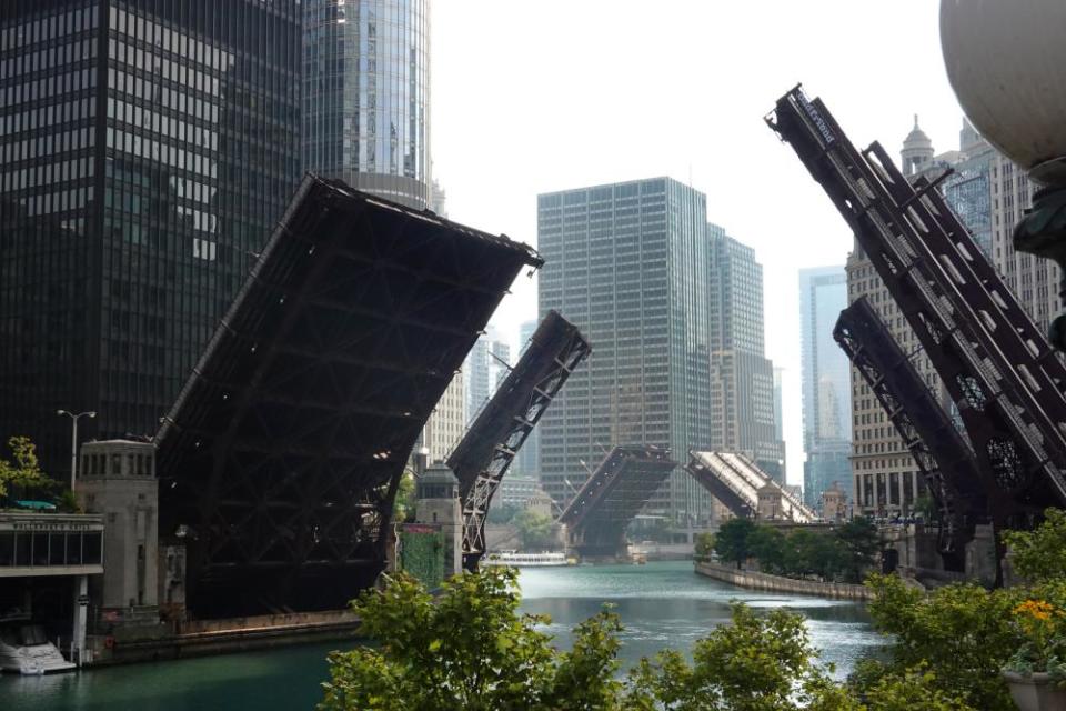 Bridges across the Chicago river are raised to control access into downtown as widespread looting broke out in the city on 10 August.