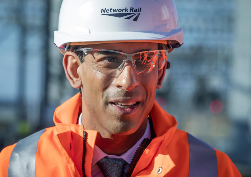 Britain's Chancellor Rishi Sunak looks on, during a visit to Leeds Station to highlight the record infrastructure spend after Wednesday's budget, in Leeds, England, Thursday March 12, 2020. (Danny Lawson/Pool Photo via AP)