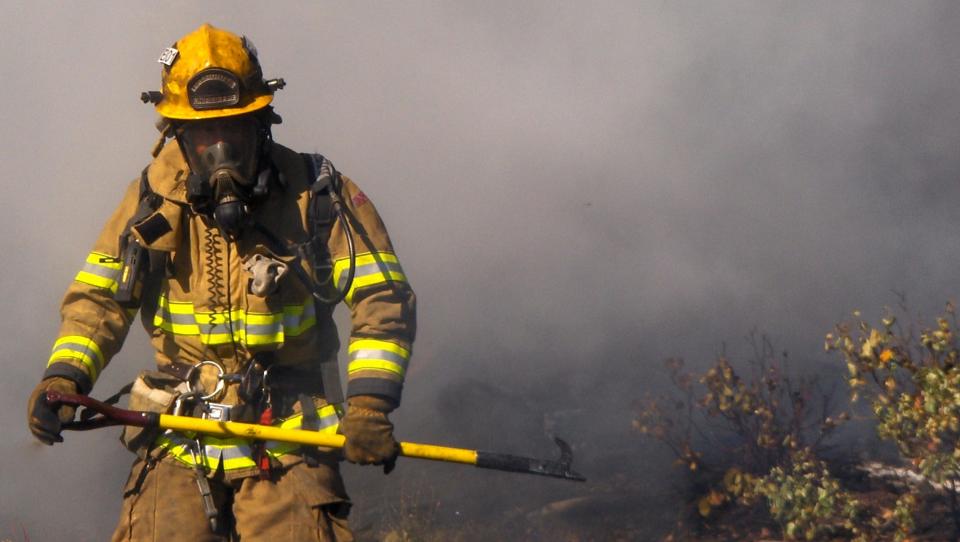 A firefighter battles a blaze on Santa Cruz Island Sunday.