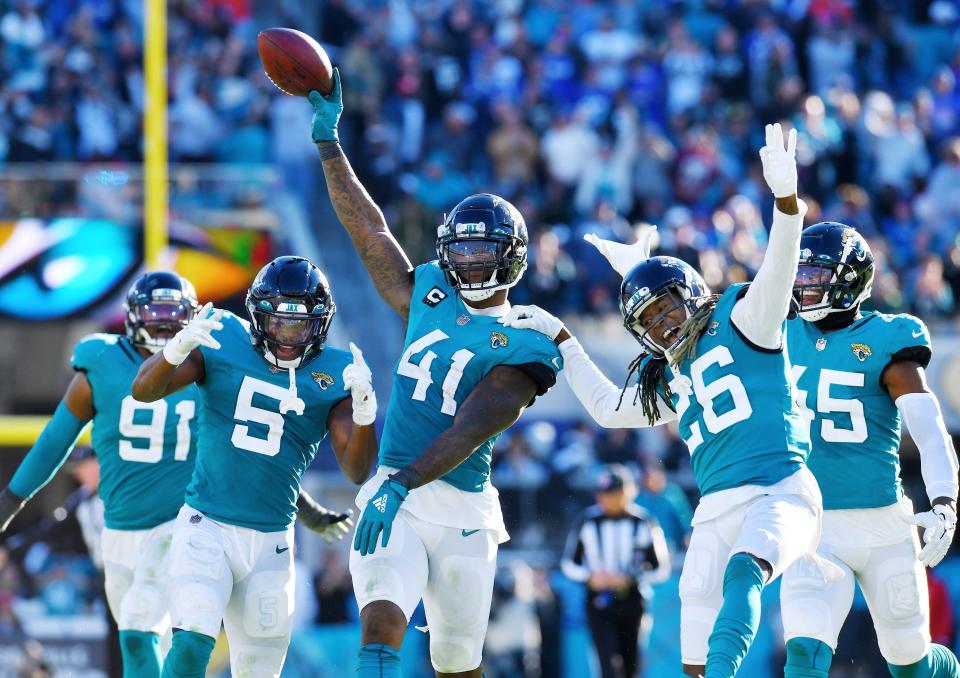 Josh Allen (41) of the Jaguars celebrates his fumble recovery against the Bills in 2021.