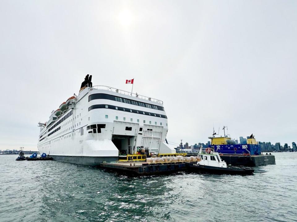 stern of a cruise ship opened next to a ship