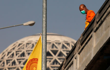 A Buddhist monk looks on during a policemen search for a fugitive Buddhist monk inside Dhammakaya temple in Pathum Thani province, Thailand February 17, 2017. REUTERS/Chaiwat Subprasom