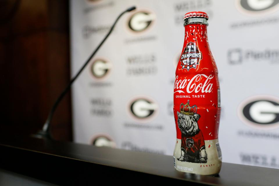 A national championship Coca-Cola on the podium after Georgia coach Kirby Smart spoke to the media on the first day of football practice ahead of the start of the season in Athens, Ga., on Thursday, Aug. 4, 2022.