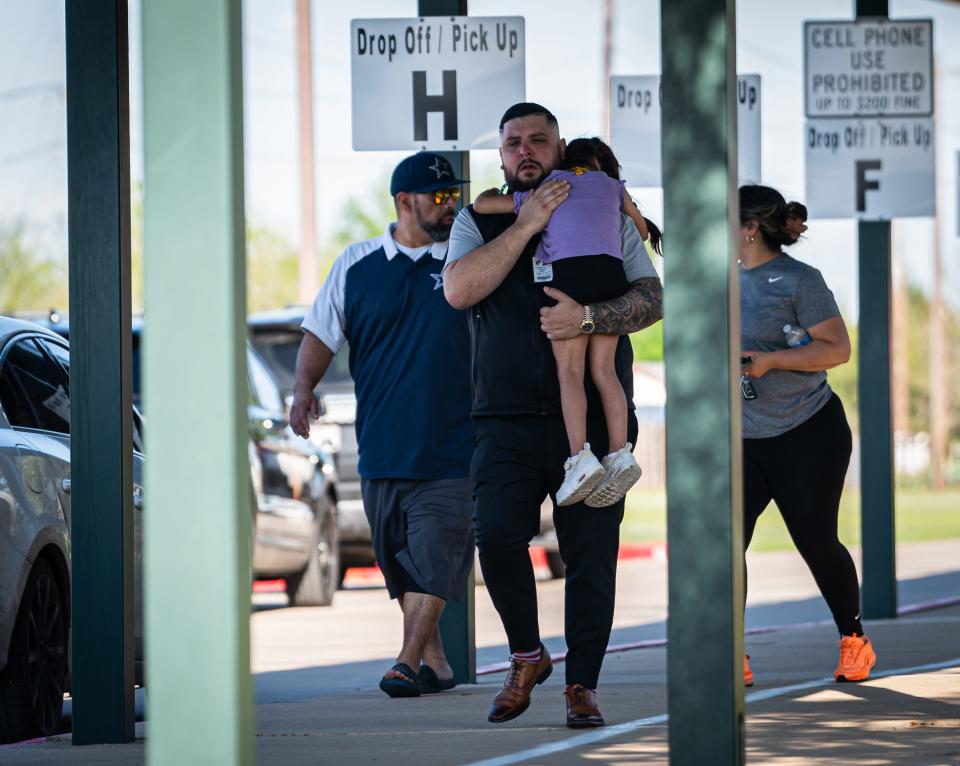 Families reunite with their children at Tom Green Elementary in Buda, Texas after Pre-K students from the school were involved in a bus roll-over crash outside of Austin, Friday, March 22, 2024.