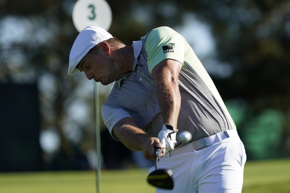 Bryson DeChambeau hits his second tee shot after his first was lost off the third fairway during the second round of the Masters golf tournament Friday, Nov. 13, 2020, in Augusta, Ga. (AP Photo/David J. Phillip)