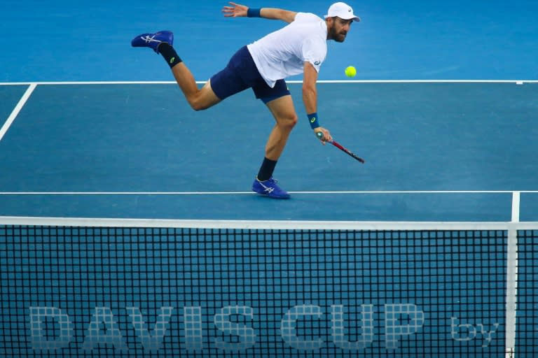 Steve Johnson of the US hits a return during their doubles tennis match against Sam Groth and John Peers of Australia in the world group quarter-final Davis Cup clash in Brisbane on April 8, 2017