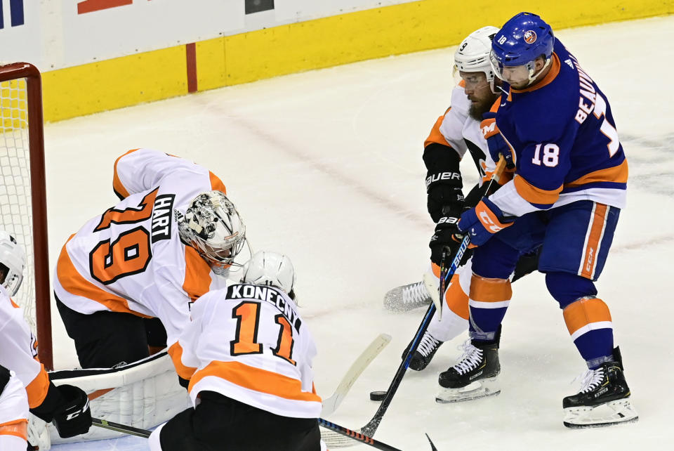 Philadelphia Flyers goaltender Carter Hart (79) makes a save against New York Islanders left wing Anthony Beauvillier (18) during first-period NHL Stanley Cup Eastern Conference playoff hockey game action in Toronto, Saturday, Aug. 29, 2020. (Frank Gunn/The Canadian Press via AP)