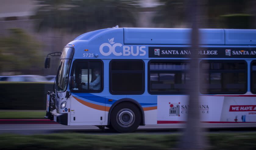 Newport Beach, CA - February 14: A bus driver drives an Orange County Transportation Authority bus. along its route in Newport Beach Monday, Feb. 14, 2022. Nearly 600 Orange County Transportation Authority (OCTA) bus drivers in Southern California are set to strike Tuesday, February 15, if negotiations with Teamsters Local 952 fail to produce an agreement before then. The previous contract expired almost a year ago, on April 30, 2021. (Allen J. Schaben / Los Angeles Times)