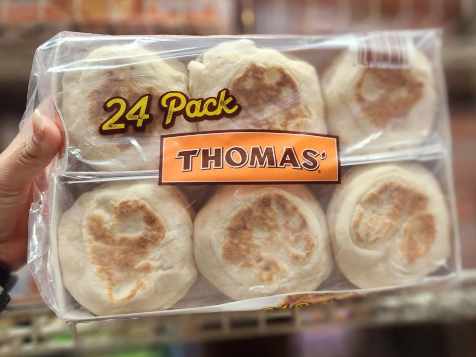 The writer holds a 24-pack of Thomas English muffins