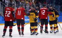 Ice Hockey - Pyeongchang 2018 Winter Olympics - Men Semifinal Match - Canada v Germany - Gangneung Hockey Centre, Gangneung, South Korea - February 23, 2018 - German and Canadian players interact after the game. REUTERS/Brian Snyder