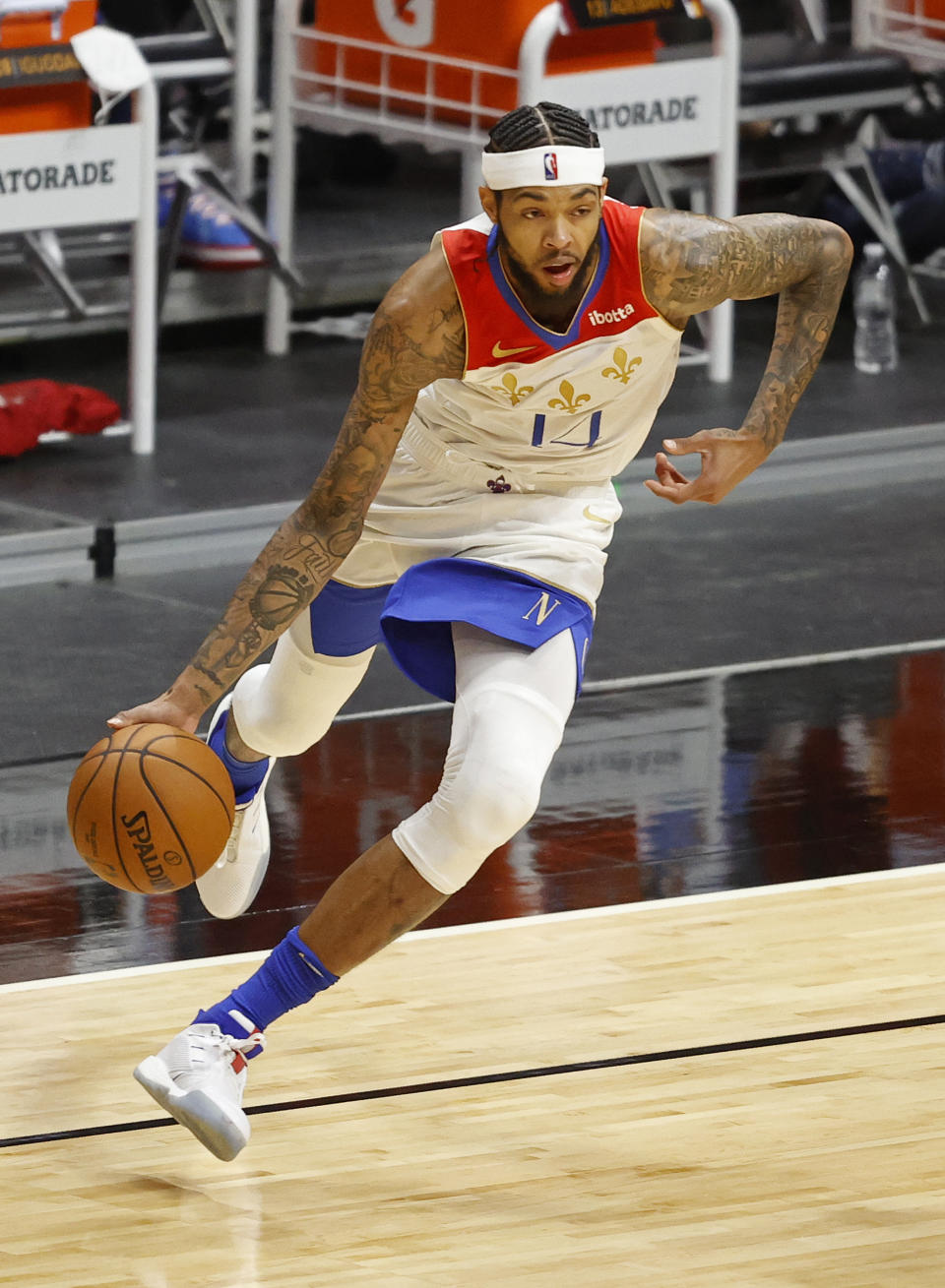 New Orleans Pelicans forward Brandon Ingram (14) dribbles the ball against the Miami Heat during the second half of an NBA basketball game, Friday, Dec. 25, 2020, in Miami. (AP Photo/Joel Auerbach)