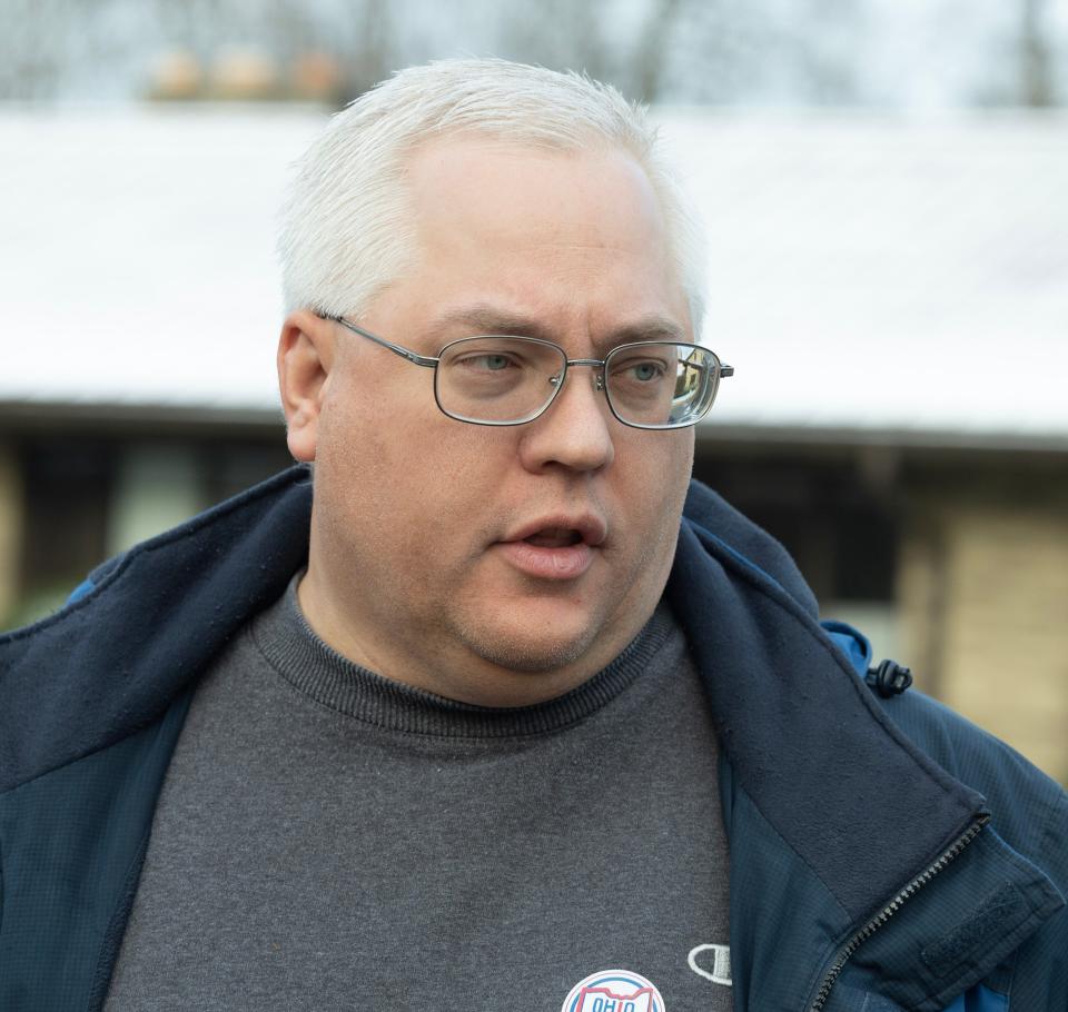 Matthew Miller talks outside the Hartville Church of the Brethren. He voted for Matt Dolan in the GOP primary race for U.S. Senate.