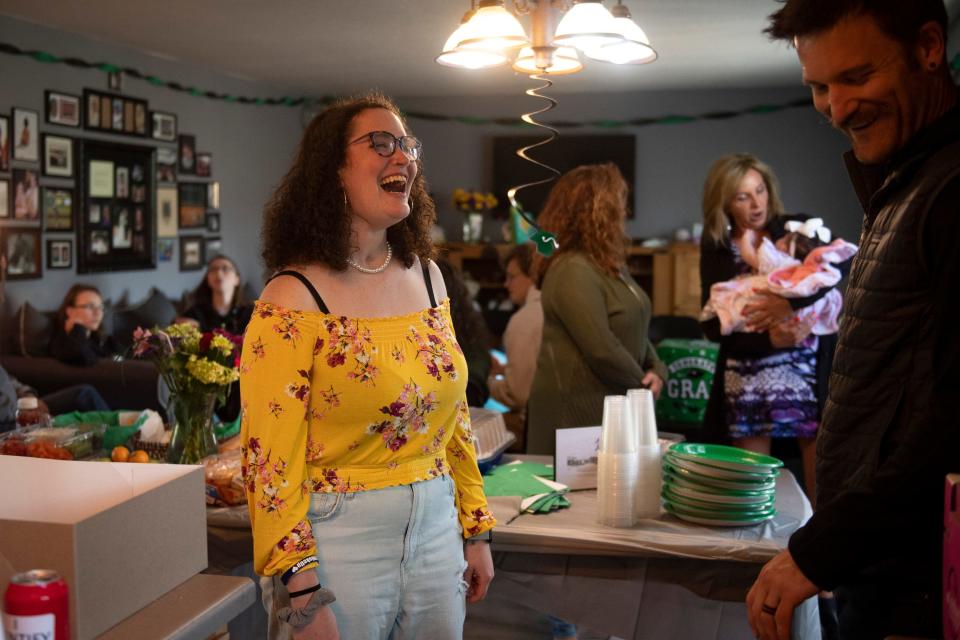 Rielle Artis enjoys the company of her friends and family during her high school graduation party at her home in Fort Collins on May 21.