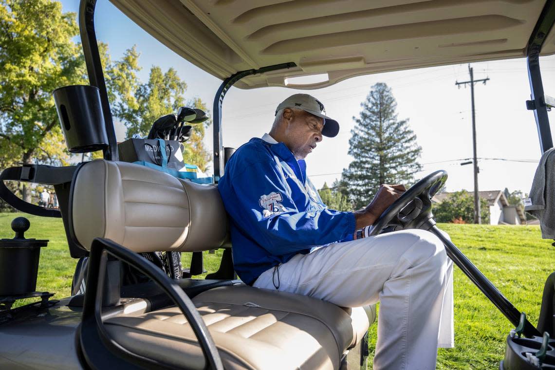 NBA legend Julius “Dr. J” Erving writes down a score as he participates in the Phil Oates Celebrity Golf Classic at North Ridge Country Club in Fair Oaks on Monday.