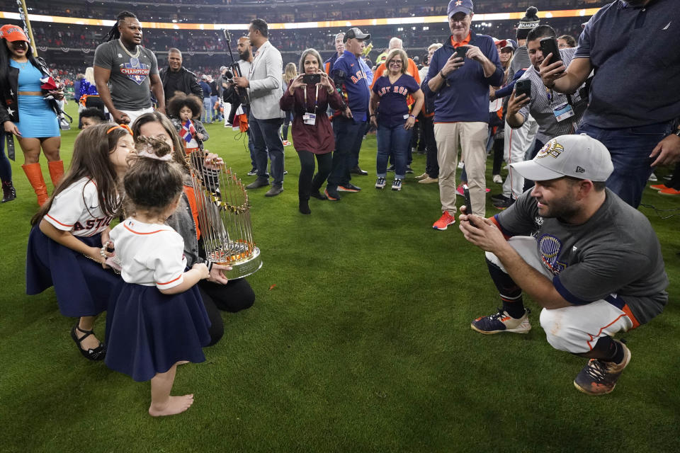 Houston Astros second baseman Jose Altuve poses with his family after the The Houston Astros won 4-1 against the Philadelphia Phillies in Game 6 on Saturday, Nov. 5, 2022, in Houston. (AP Photo/Tony Gutierrez)