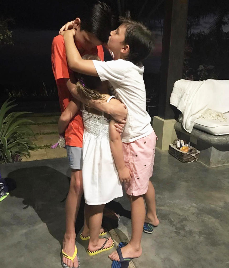 Tom Brady's three kids, Jack, Benjamin and Vivian stand in a group hug. (@gisele via Instagram)