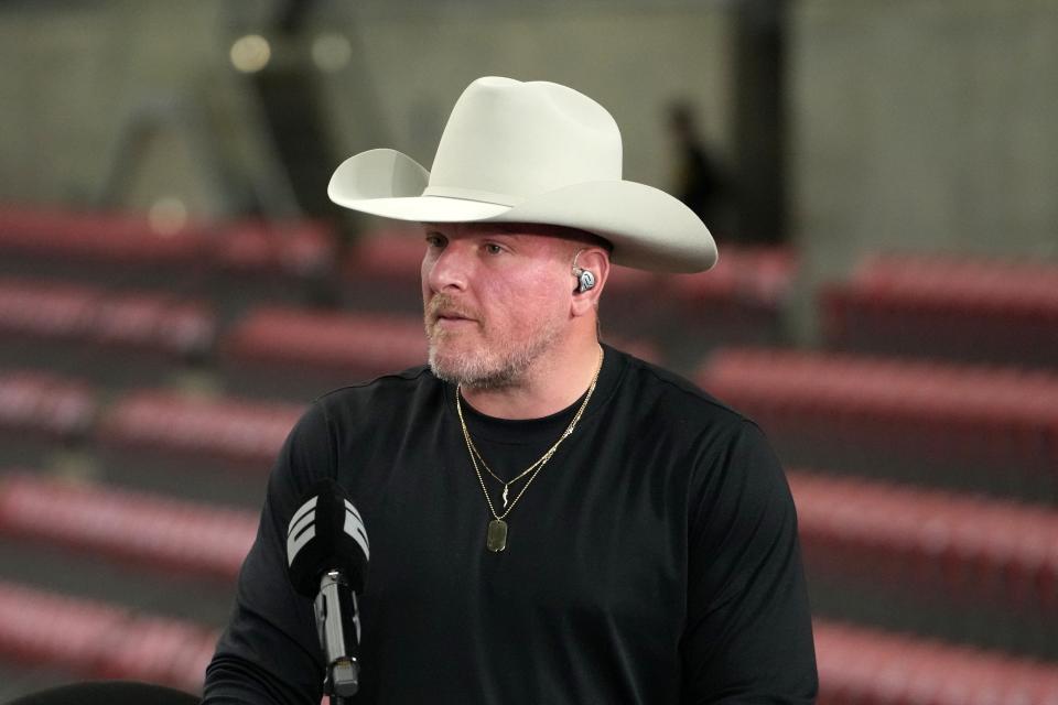 Pat McAfee talks on a set Monday before the 2024 College Football Playoff national championship game between the Michigan Wolverines and the Washington Huskies at NRG Stadium.