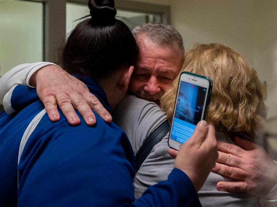 Ricky Leo Davis is released from custody and hugs mom Maureen Klein, right, and another family member at the El Dorado County Jail after he was exonerated in the 1985 murder of Janet Hylton on Feb. 13, 2020, in Placerville. Davis’ girlfriend, now-deceased Connie Dahl, had her voluntary manslaughter charge vacated Friday in court.