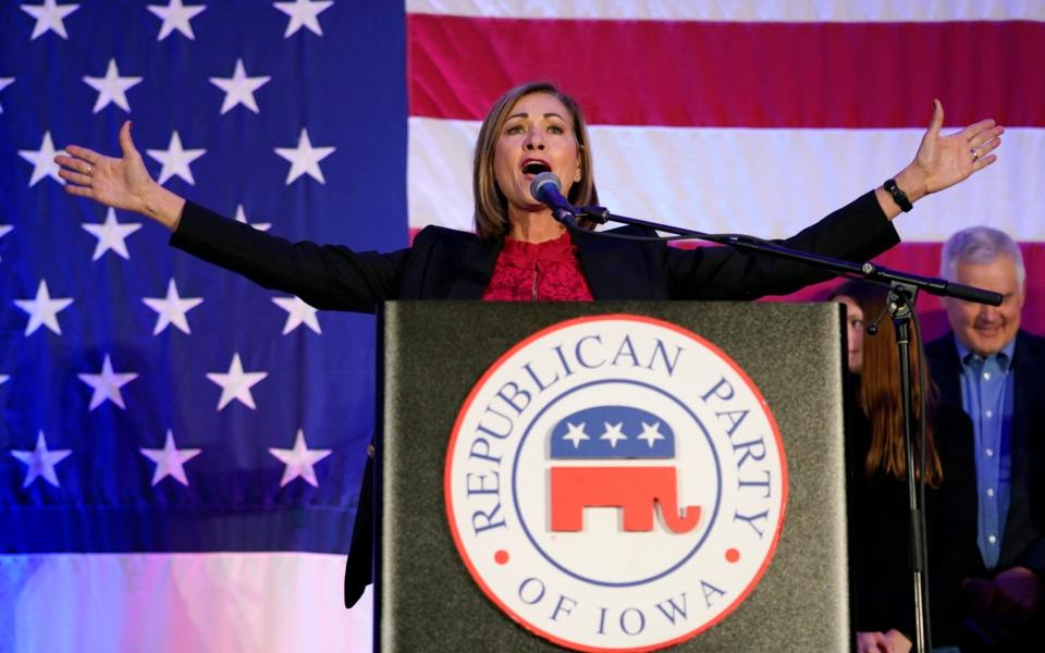 Iowa Gov. Kim Reynolds - AP Photo/Charlie Neibergall