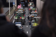 Protesting farmers block a main road leading to the center of The Hague, Netherlands, Wednesday, Oct. 16, 2019. Thousands of Dutch farmers protest over the Netherlands efforts to drastically reduce emissions of greenhouse gases. Among the farmers' demands are that the government does not further reduce the number of animals they can keep. (AP Photo/Peter Dejong)