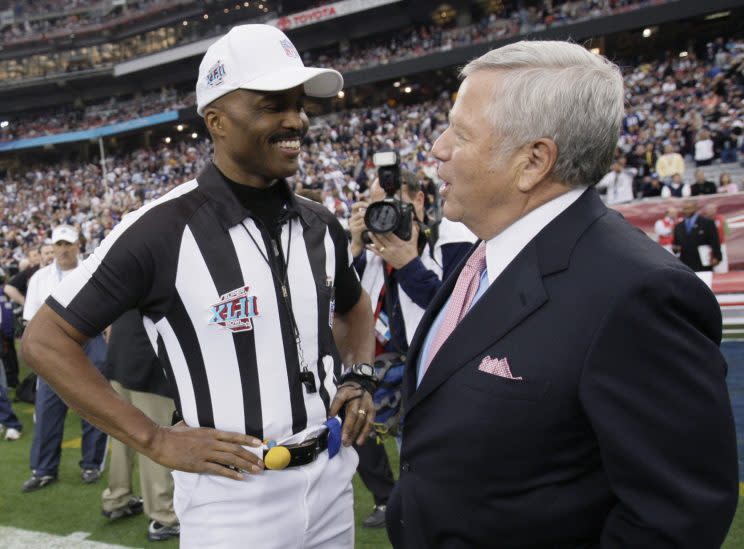 Referee Mike Carey chats with Patriots owner Robert Kraft before Super Bowl XLII. (AP)