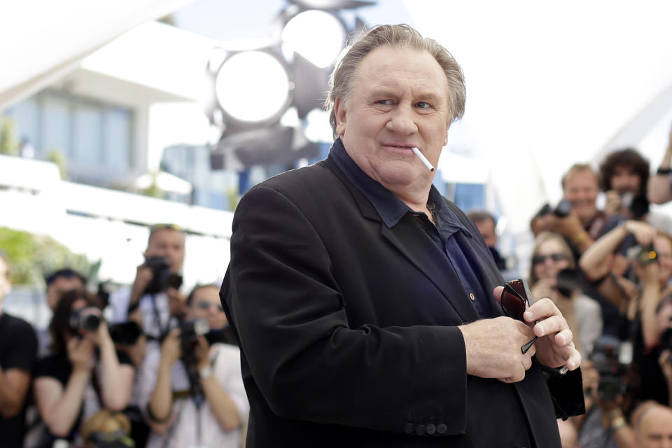 FILE - Actor Gerard Depardieu poses for photographers during a photo call for the film Valley of Love, at the 68th international film festival, Cannes, southern France, Friday, May 22, 2015. The French film industry has recently been shaken by accusations against actor Gerard Depardieu. As French cinema basks in Oscar attention, actresses who allege they were teenage victims of sexual abuse by directors decades older than them are shining the light on the repulsive underside of French cinema (AP Photo/Thibault Camus, File)