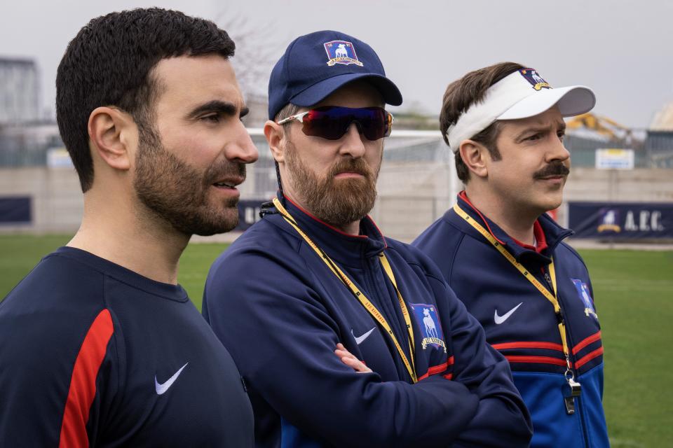 AFC Richmond coaches, from left, Roy Kent (Brett Goldstein), Coach Beard (Brendan Hunt) and Ted Lasso (Jason Sudeikis) survey a practice session.